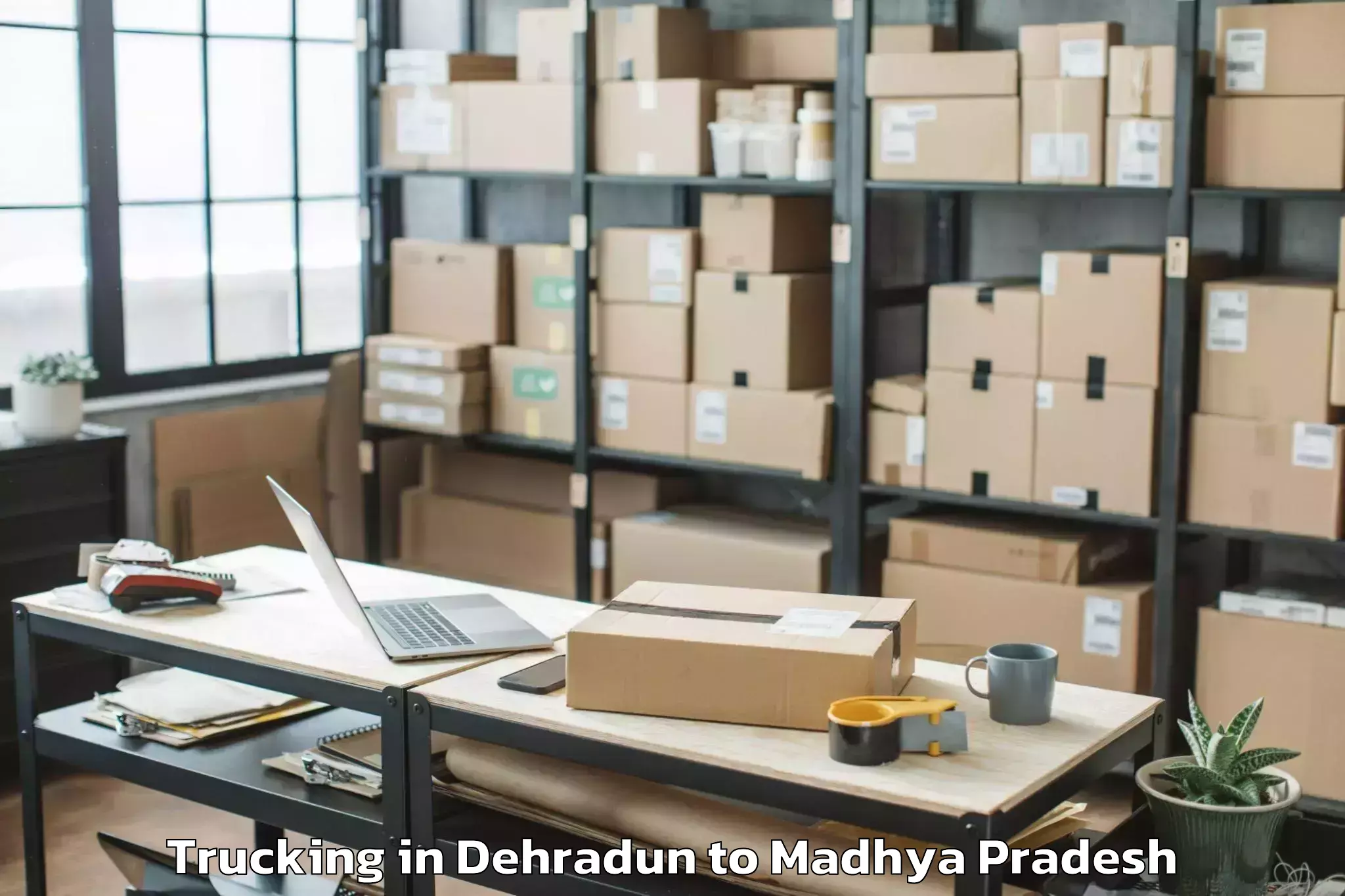 Book Dehradun to Hatod Trucking Online